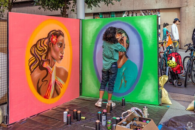 This artists added the fine detail to her mural at the Street Art Festival.