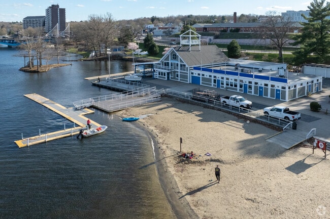 People are on the beach at Regatta Point in Worcester.