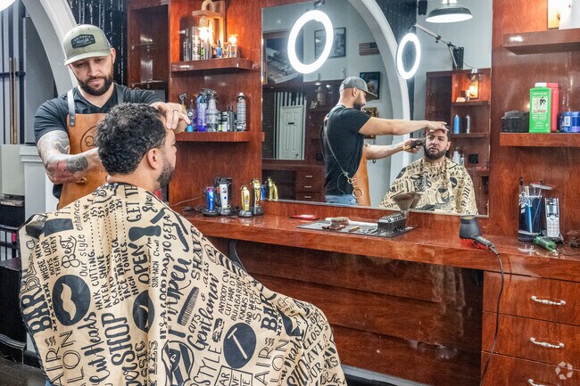 Old Tyme Barbershop in Bellerose Terrace offers haircuts and pool in a retro-modern setting.