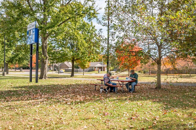 Two co-workers are enjoying lunch at Douglass Park near Sandersville.