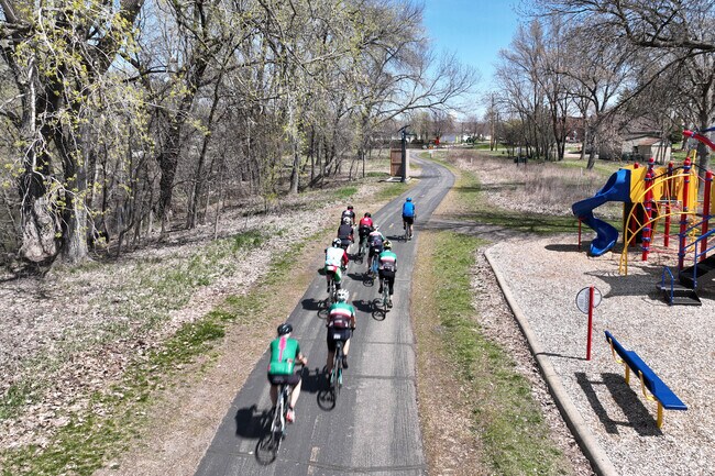 Bikers enjoying the Texa-Tonka Park trail that runs along Victoria Lake.