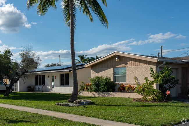 Woodstock homes line the palm tree lined streets in this Florida neighborhood.
