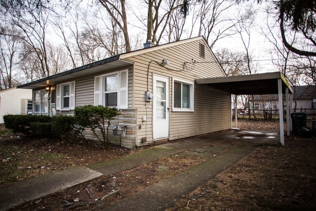 Covered parking near the side door.