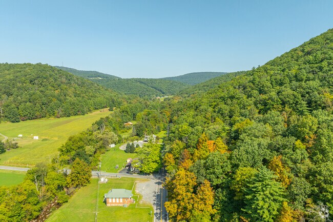 Rolling hills cradle winding roads in Boggs Township.