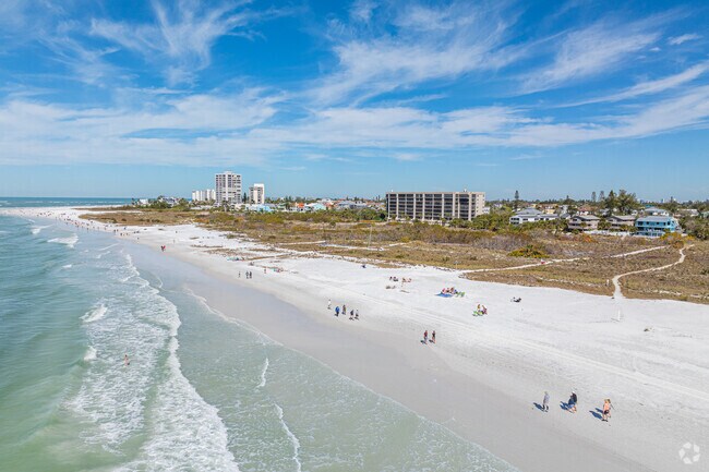 Siesta Key’s white sand beaches sit about eight miles from Sarasota Springs.