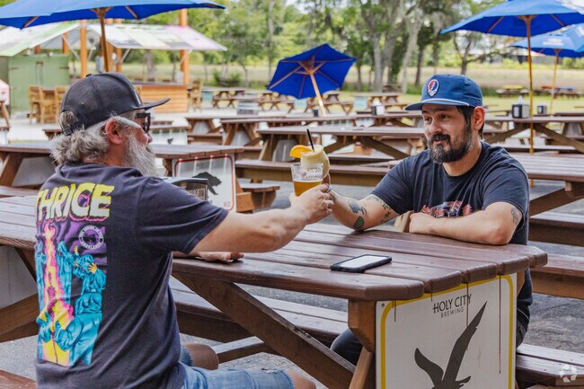 Enjoy a cold beer with friends on the outdoor patio at Holy City Brewing in Park Circle.