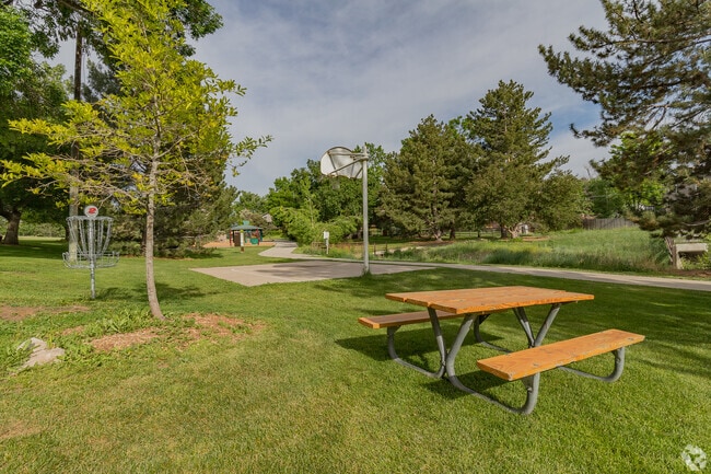 Picnic table near basketball court at Walnut Hills Park.