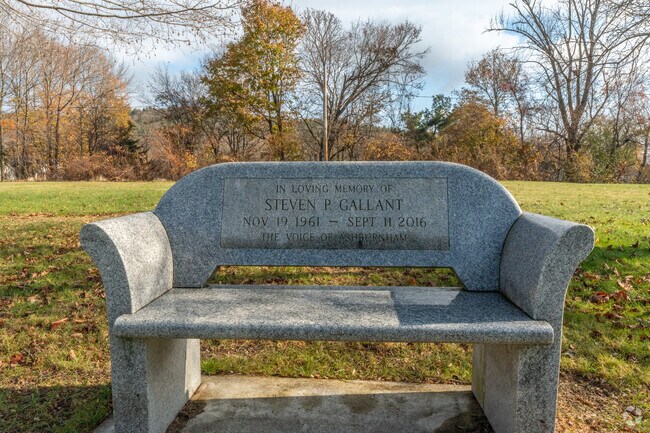 A memorial bench at Winchester Park dedicated to beloved resident Steven P. Gallant.