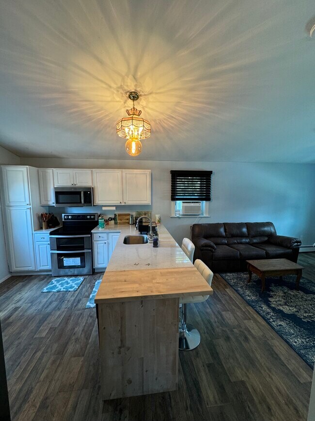 Bathroom view of kitchen and living room.