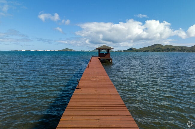 A long dock leads into the Waikalua-Loko Fish Pond near Kāneʻohe Beach Park.