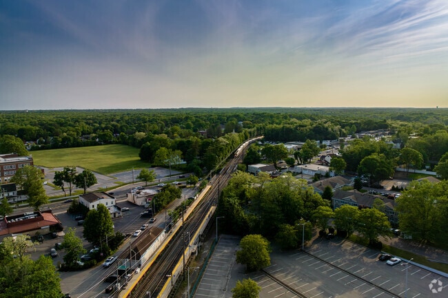 The train is just about to arrive at the Smithtown station.