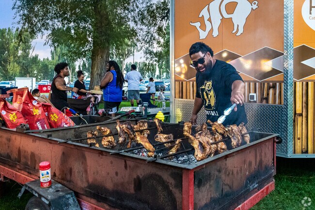 Local businesses sell food at Pioneer Day Playland, like this traditional b-b-q.