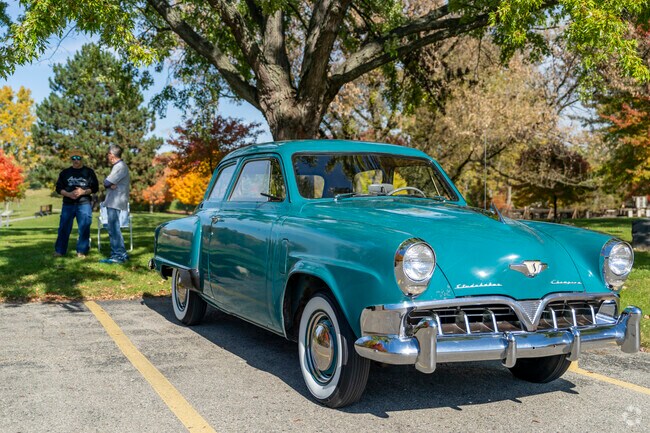 These gentlemen discuss the history of cars on a nice day in Plymouth Township.