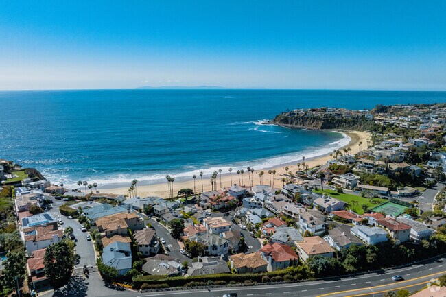 Emerald Bay boasts a private beach, lush parks, and top-tier amenities for its exclusive residents.