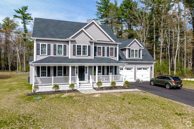 Center-entry colonial with a porch at Daisy Lane Estates in East Bridgewater.