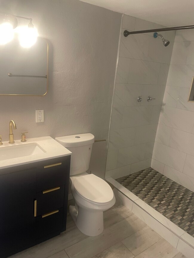 New bathroom with gold finishes