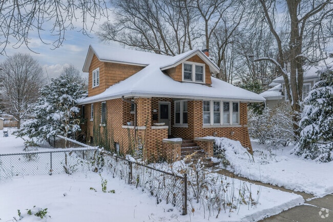 Cape Cod homes line tree-filled streets on modest lots in Crown Park neighborhood.