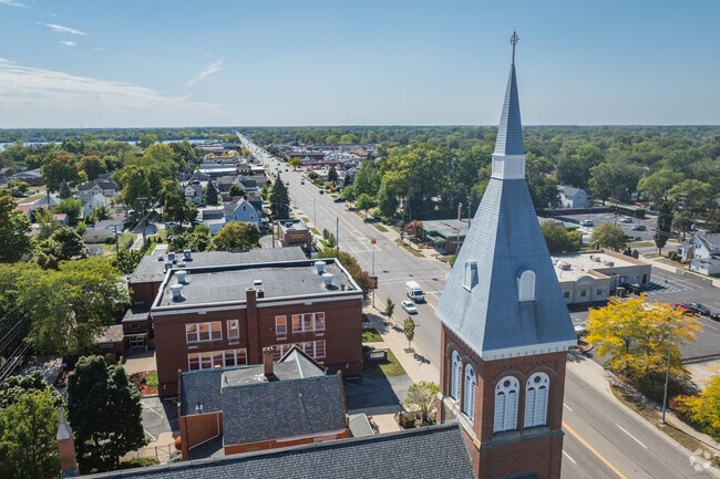 St. John the Baptist Catholic Church
looks over Central Monroe in the afternoon sun.