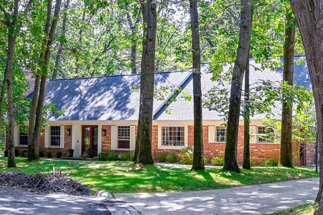 A heavily wooded New England-inspired Cape Cod is one of 42 homes in Parkview Hills.