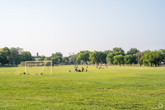 Kids playing on the Soccer field in Washington Park which is near the  Walnut Hill Neighborhood.
