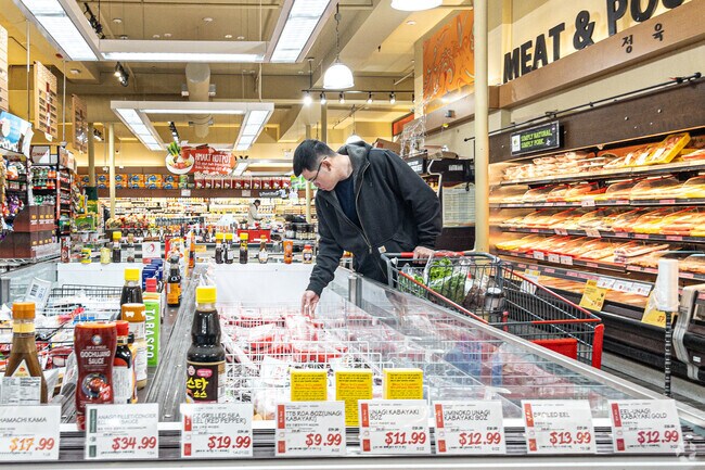 Herricks residence pick up their goods at H Mart.