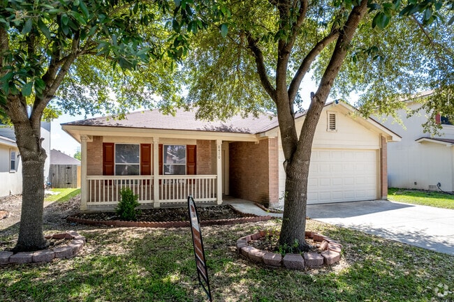 Single-story brick home with a porch in Converse, Texas.