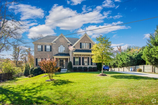 Majestic homes sitting on lush green lawns can be found throughout Laurel Hill.