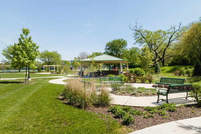 Relax on 8 acres of green space and park amenities at Plum Grove Park in Creekside.