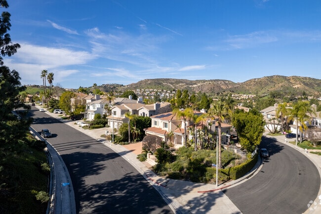 Tree-lined streets and tidy lawns define the West Hills neighborhood in California.