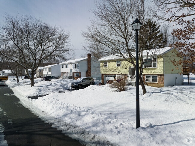 Homes feature single car garages.
