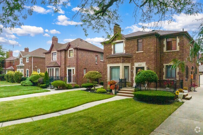 Large brick and masonry Tudor-inspired homes neatly line the streets of Oakman Boulevard Community.