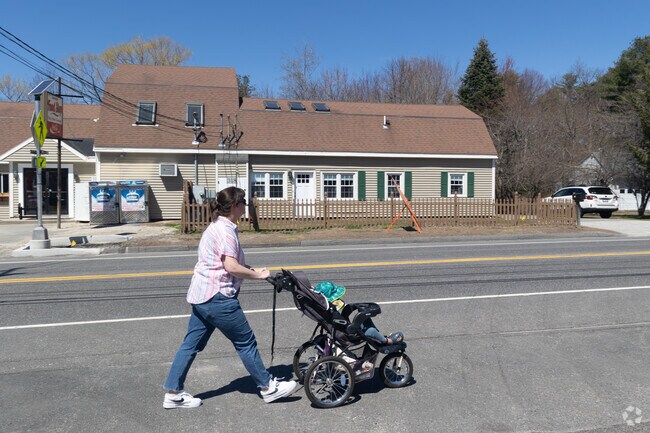 A mother and child take a stroll in Cumberland Center.