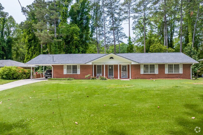 Ranch homes feature broad front lawns and classic red brick exteriors in Peyton Forest.