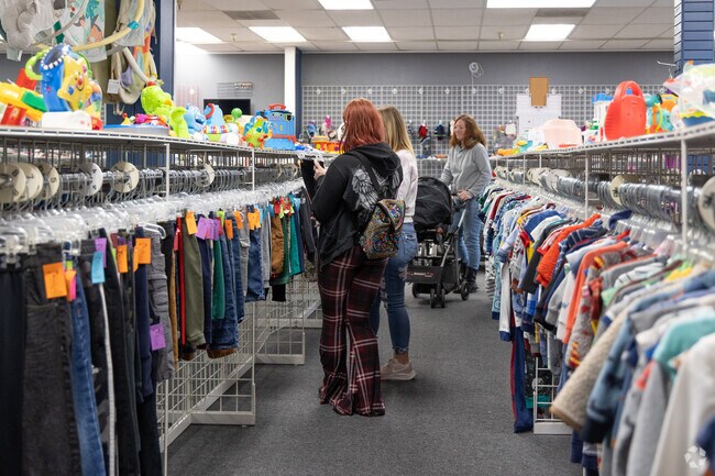Shoppers browse children's clothing in Portland's Pleasant Valley.