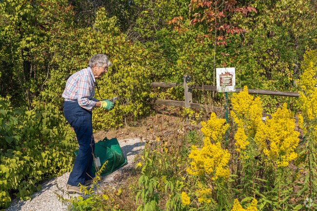 Local residents maintain the Omena Garden and keep the pollinators happy.