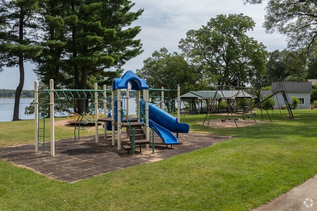 Kids love playing on the playground by the lake at Wolf Lake Park.