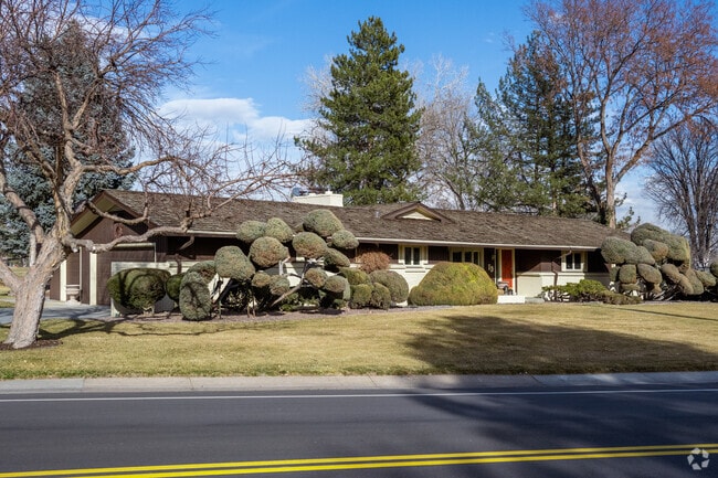 A traditional ranch home with exquisite landscaping in Columbine Valley, Colorado.