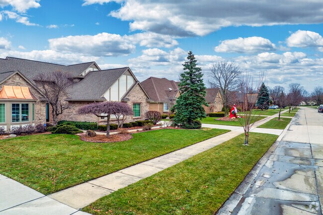 A row of homes featuring large lots, sidewalks and safe streets in Sterling Heights.
