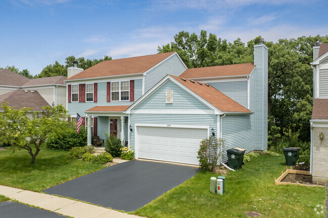 Homes in Hainesville sit on well-maintained lawns.