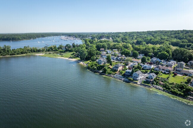 This is an aerial view of the bay and houses in Cowesett, RI.