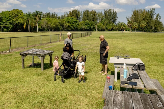 A family gathers to discuss their drone flight plan in the Sunrise neighborhood.