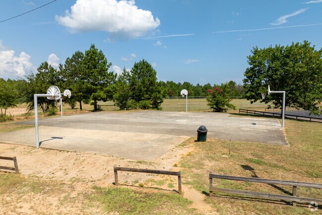 Clausell Community Park features a basketball court with four hoops.