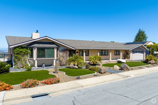 The well-manicured front lawns in Bay-O-Vista contribute to the overall appeal of the area.