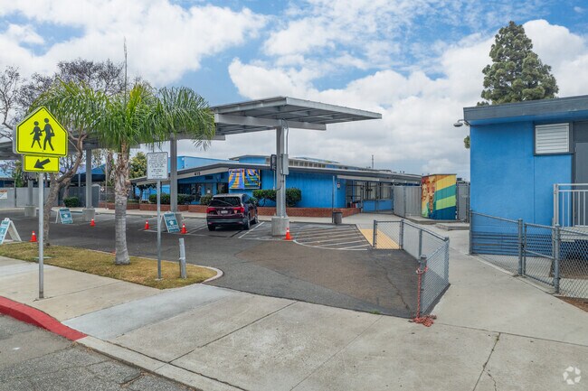 Parents proudly drop off their children at the entrance of King-Chavez Primary Academy.