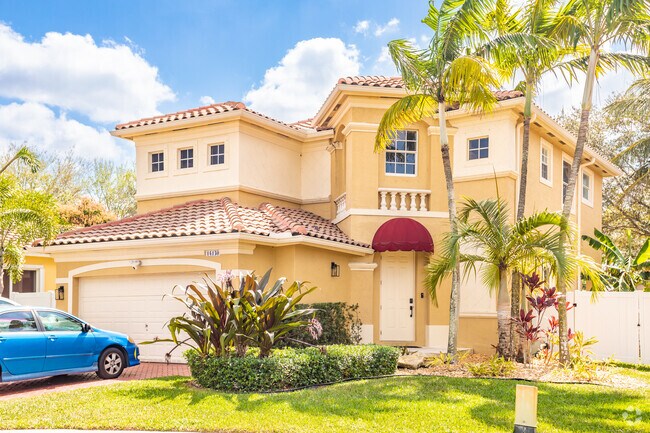 Many homes in the Miramar Patio Homes neighborhood have palm trees.