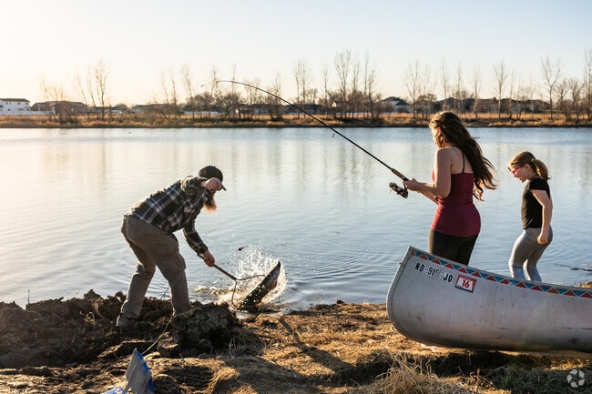 Locals wrestle Northern Pikes and other fish to shore at the pond in Cottonwood Park.