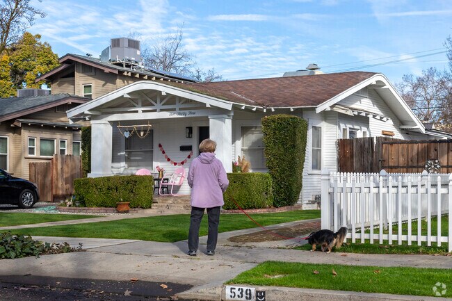 Enjoy walking your dog down the sidewalks of the Roeding Park area of Fresno.