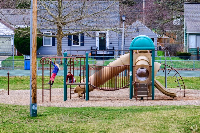 Children play on the playground in Quentin Park, a beautiful park in the community's center.
