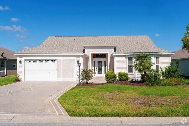 This Village of Palo Alto home features a garage screen for open-air work enjoyment.
