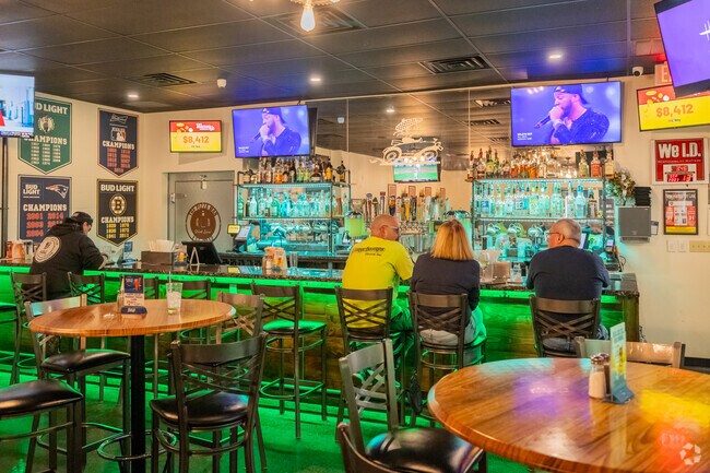 Locals enjoy some beers and pizza at The Pizza Man in Southeast Manchester.
